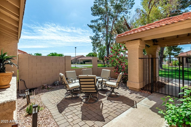 view of patio / terrace featuring fence and outdoor dining space