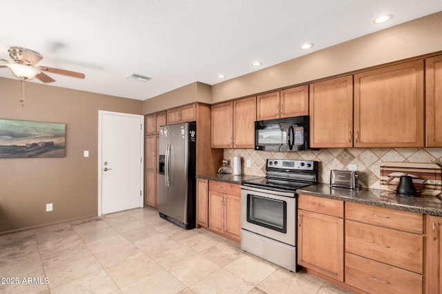kitchen featuring stainless steel appliances, tasteful backsplash, visible vents, a ceiling fan, and brown cabinetry