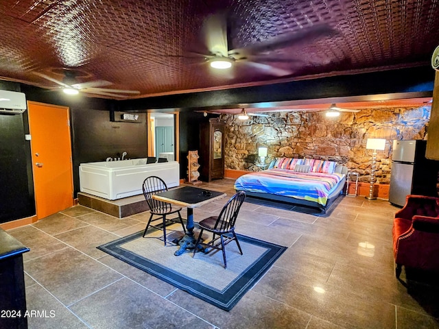 tiled bedroom with a wall mounted air conditioner and stainless steel refrigerator