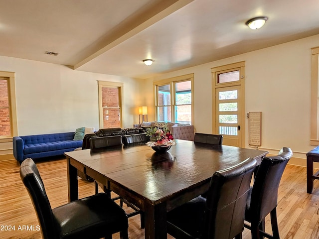 dining space featuring light wood-type flooring