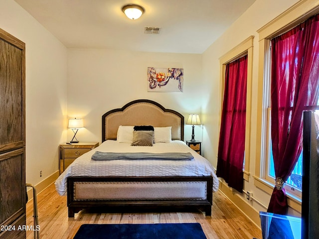 bedroom with light hardwood / wood-style floors