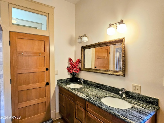 bathroom featuring dual vanity