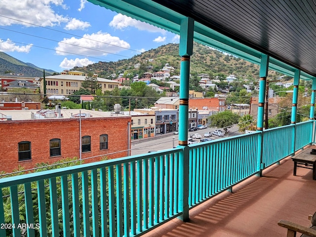 balcony featuring a mountain view