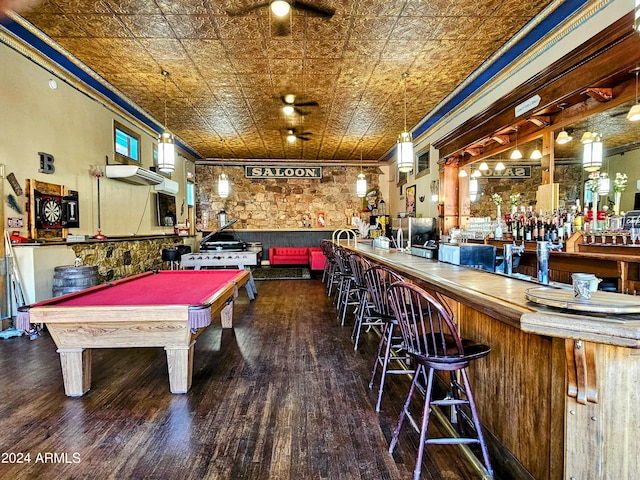 recreation room with indoor bar, dark wood-type flooring, ornamental molding, and billiards