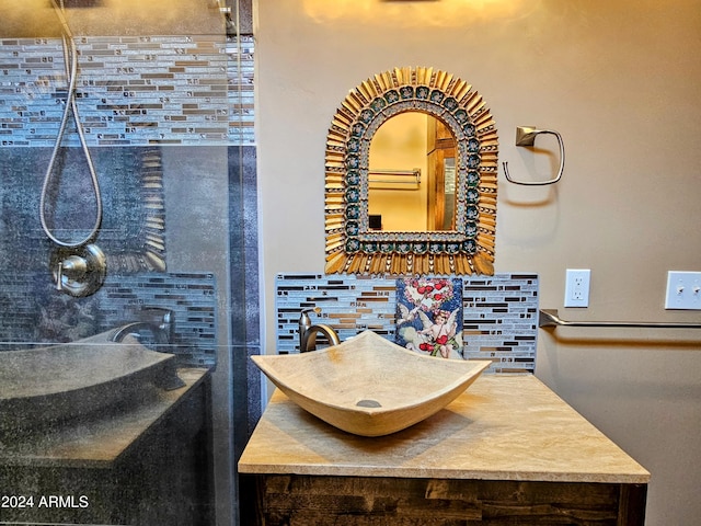 bathroom with vanity and decorative backsplash