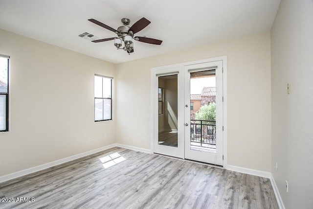 20750 N 87th St Unit 2103, Scottsdale, AZ 85255 - unfurnished room featuring wood finished floors, baseboards, and ceiling fan