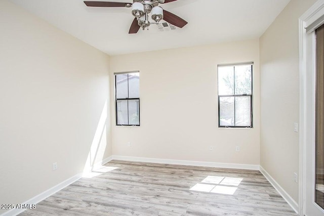 20750 N 87th St Unit 2103, Scottsdale, AZ 85255 - unfurnished room with ceiling fan, light wood finished floors, and baseboards