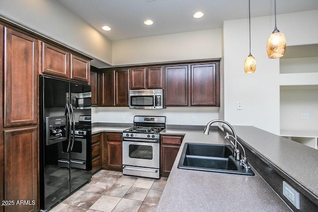 20750 N 87th St Unit 2103, Scottsdale, AZ 85255 - kitchen featuring stainless steel appliances, a sink, hanging light fixtures, recessed lighting, and dark brown cabinets