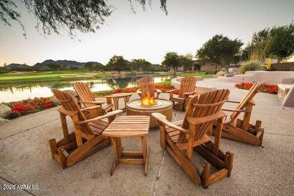 20750 N 87th St Unit 2103, Scottsdale, AZ 85255 - view of patio / terrace featuring a fire pit and a water view