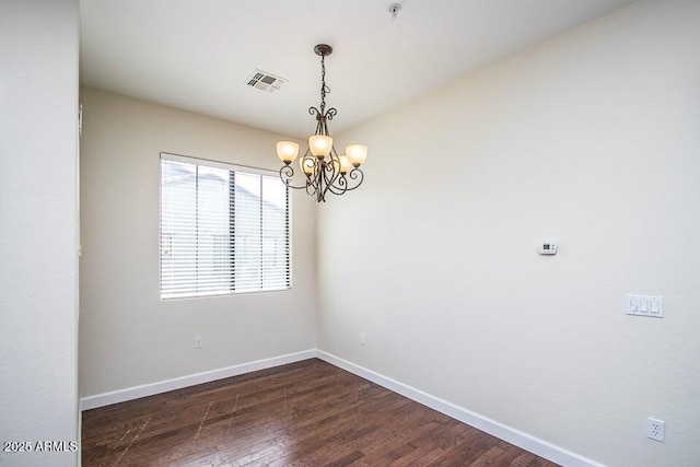 20750 N 87th St Unit 2103, Scottsdale, AZ 85255 - empty room with a chandelier, baseboards, dark wood-type flooring, and fire sprinkler in ceiling