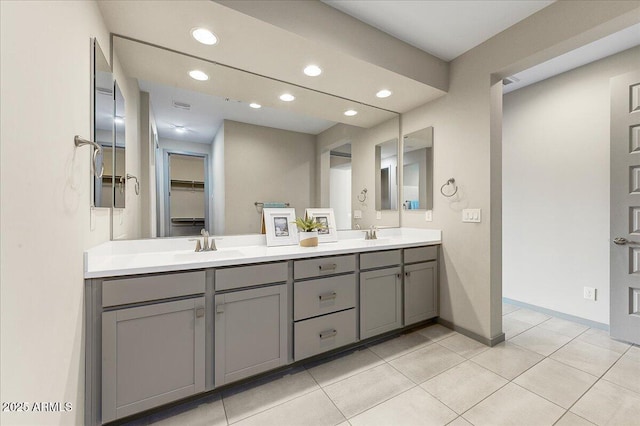 bathroom with vanity and tile patterned floors