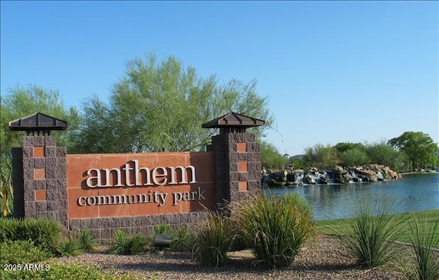 community sign with a water view