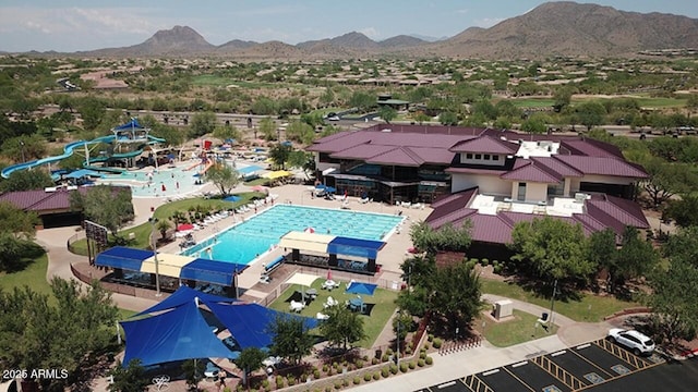 birds eye view of property with a mountain view