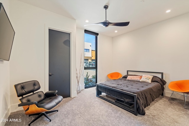 bedroom with ceiling fan and light colored carpet