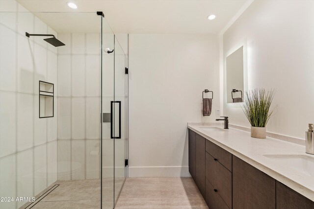 bathroom with vanity and an enclosed shower