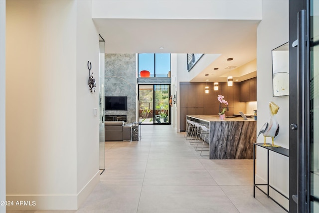 hallway featuring light tile patterned floors