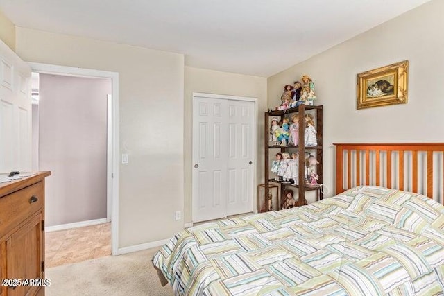 bedroom with light carpet and a closet