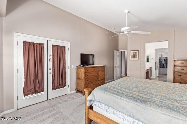 bedroom with ceiling fan, french doors, light colored carpet, and vaulted ceiling