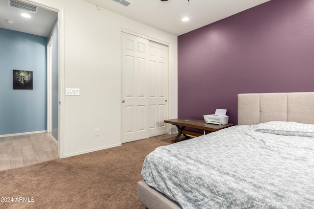 carpeted bedroom featuring a closet