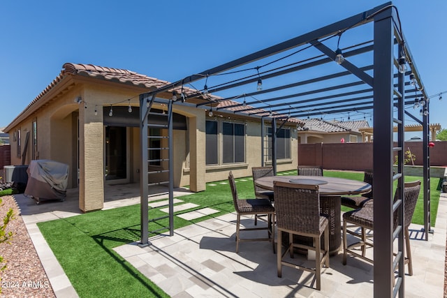 view of patio featuring a pergola and central AC