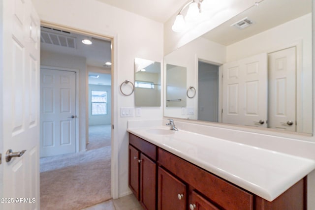 bathroom with tile patterned floors and vanity