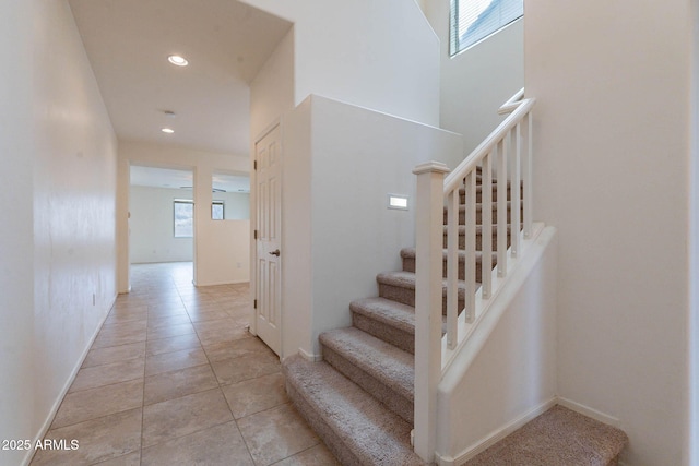 stairs featuring tile patterned floors