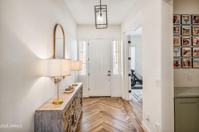 foyer featuring baseboards