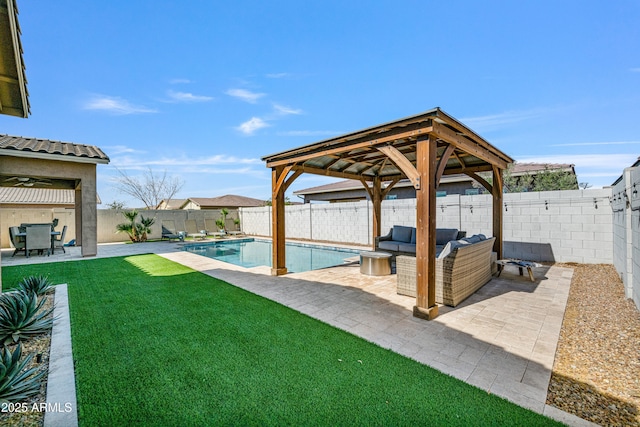 view of yard featuring a fenced backyard, a gazebo, outdoor lounge area, a fenced in pool, and a patio area