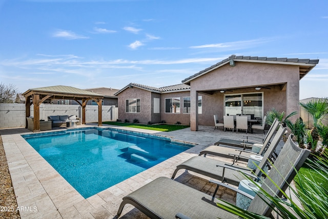 view of pool with a fenced backyard, a gazebo, a fenced in pool, an outdoor hangout area, and a patio area