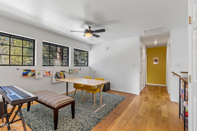 dining space featuring ceiling fan and light hardwood / wood-style flooring