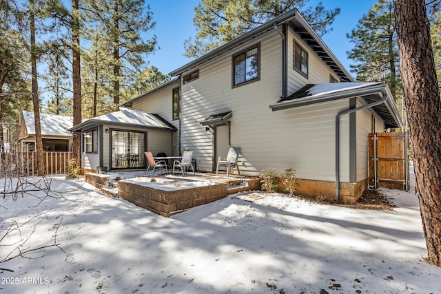 view of snow covered house