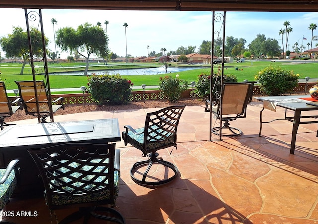 view of patio featuring a water view