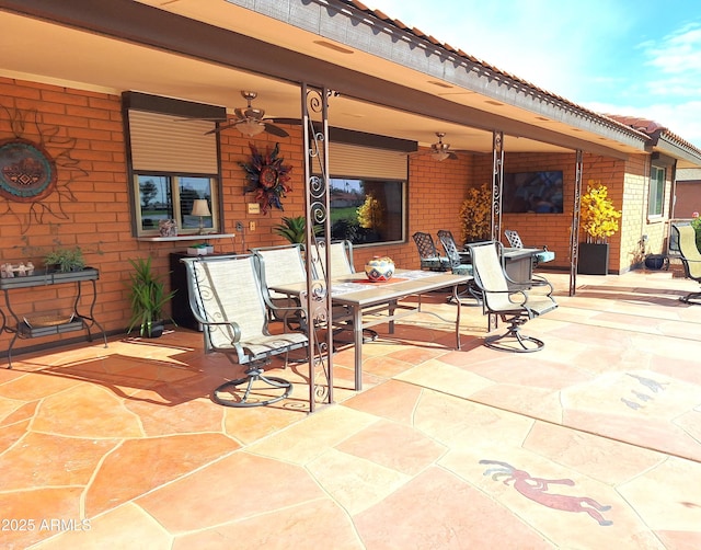 view of patio / terrace featuring ceiling fan