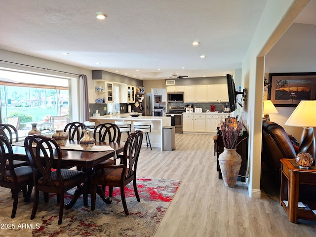 dining room featuring light hardwood / wood-style flooring