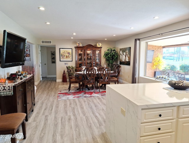 dining space featuring light hardwood / wood-style flooring