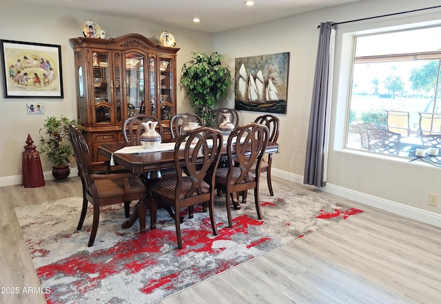 dining area with a healthy amount of sunlight and light wood-type flooring