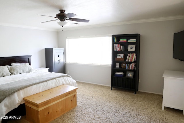 bedroom featuring ceiling fan, ornamental molding, and carpet floors