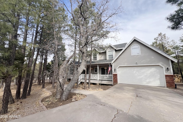 view of front of home with a porch and a garage