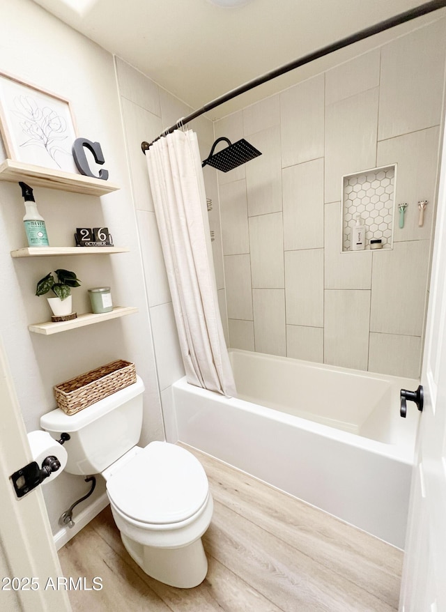 bathroom with hardwood / wood-style flooring, toilet, and shower / bath combo with shower curtain