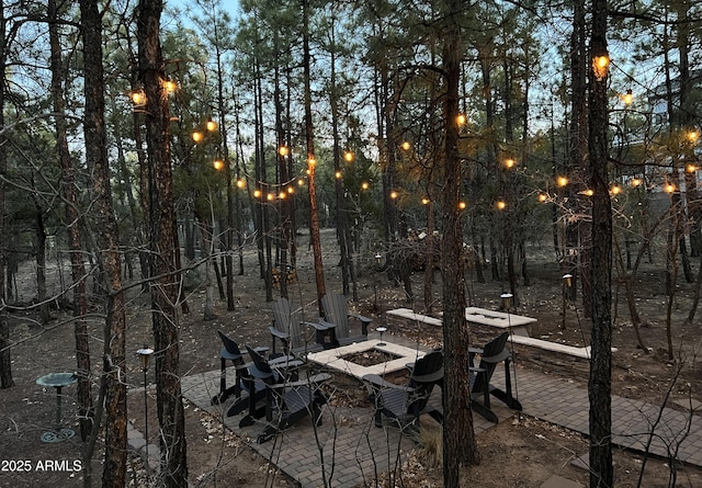 patio terrace at dusk with an outdoor fire pit