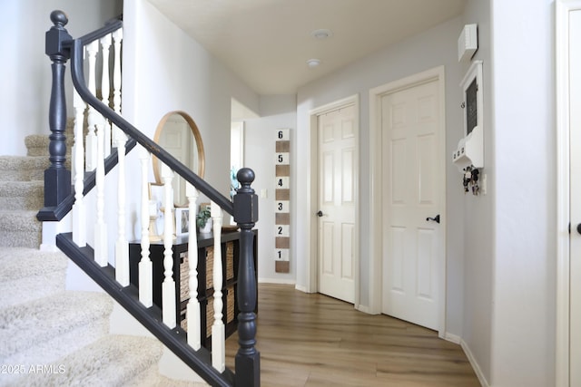 stairway with wood-type flooring