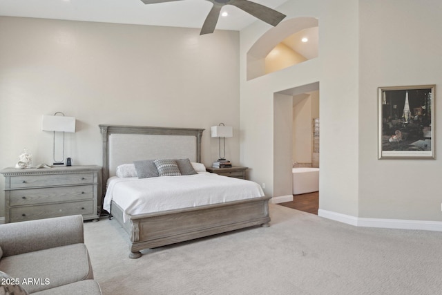 4960 E Dale Ln, Cave Creek, AZ 85331 - carpeted bedroom featuring baseboards, connected bathroom, a towering ceiling, ceiling fan, and recessed lighting