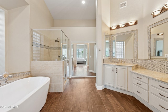 4960 E Dale Ln, Cave Creek, AZ 85331 - full bath featuring a shower stall, a freestanding bath, vanity, and wood finished floors