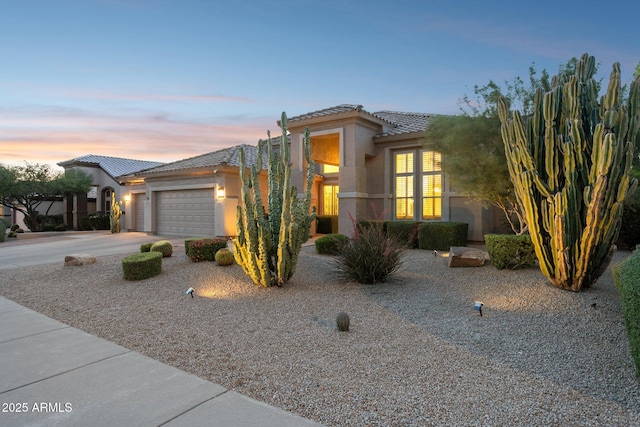 4960 E Dale Ln, Cave Creek, AZ 85331 - view of front of property featuring stucco siding, a tile roof, a garage, and concrete driveway