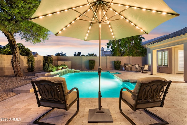 4960 E Dale Ln, Cave Creek, AZ 85331 - pool at dusk featuring a fenced backyard and a patio area
