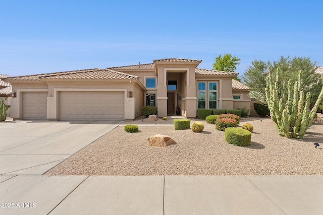 4960 E Dale Ln, Cave Creek, AZ 85331 - view of front of property featuring an attached garage, concrete driveway, stucco siding, and a tiled roof
