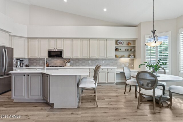 4960 E Dale Ln, Cave Creek, AZ 85331 - kitchen with appliances with stainless steel finishes, light countertops, tasteful backsplash, decorative light fixtures, and recessed lighting