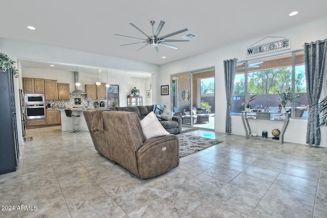 living room featuring ceiling fan