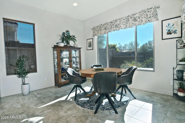 dining area featuring light tile patterned flooring