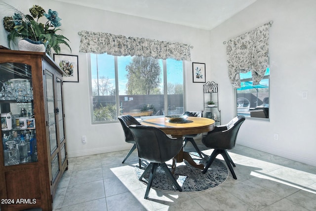 dining area featuring light tile patterned floors